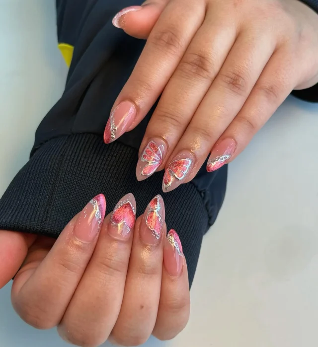 Glitter wings and glossy things ✨🦋

Book now at: https://gemmanailsspa.ca
#NailArt #ButterflyNails #PinkNails #ChromeNails #GlitterNails